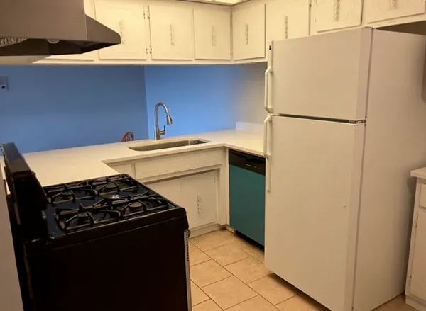 a view of a room with wooden floor and windows