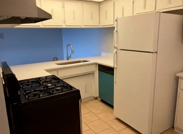 a view of a room with wooden floor and windows