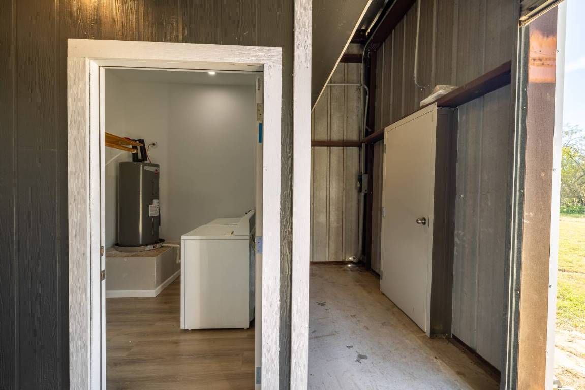 304 East 9th Nordheim, TX 78141 - Photo 19 of 33 a view of a hallway with wooden floor and windows
