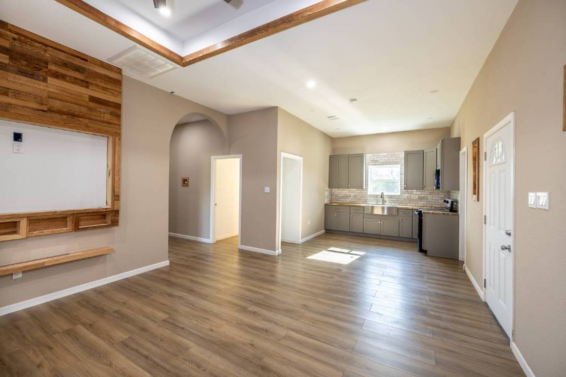 304 East 9th Nordheim, TX 78141 - Photo 3 of 33 a view of a kitchen with a sink and a refrigerator