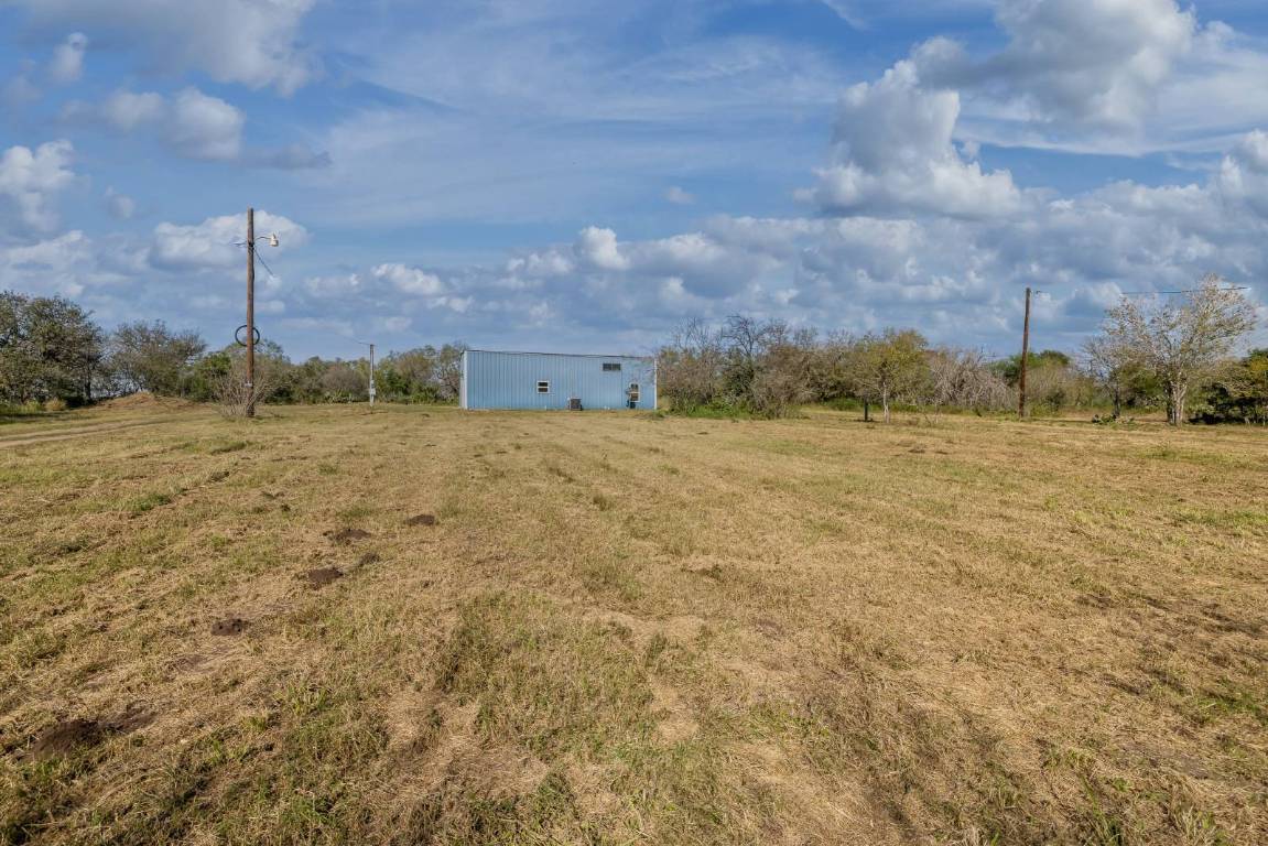 304 East 9th Nordheim, TX 78141 - Photo 32 of 33 a view of a big yard with an buildings