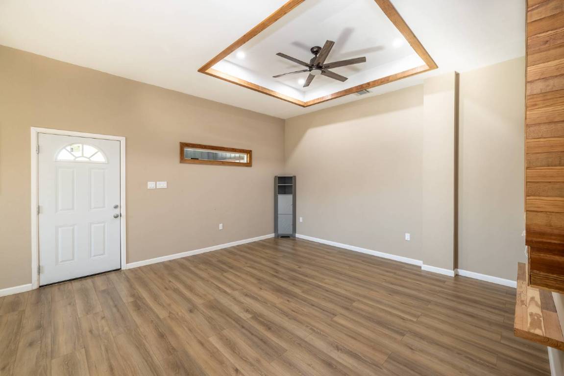 304 East 9th Nordheim, TX 78141 - Photo 4 of 33 a view of empty room with wooden floor