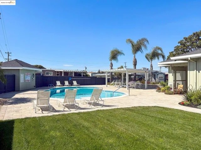 a view of a swimming pool with a patio