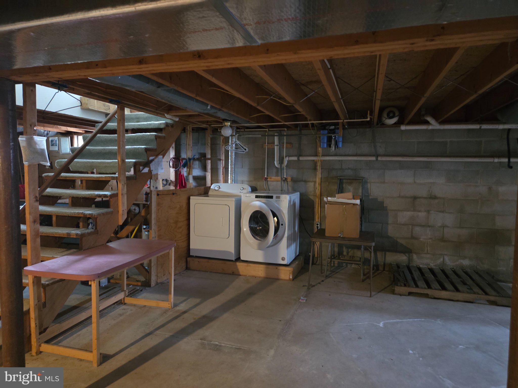 1378 Woodlytown Road Magnolia, DE 19962 - Photo 15 of 15 a storage room with washer and dryer