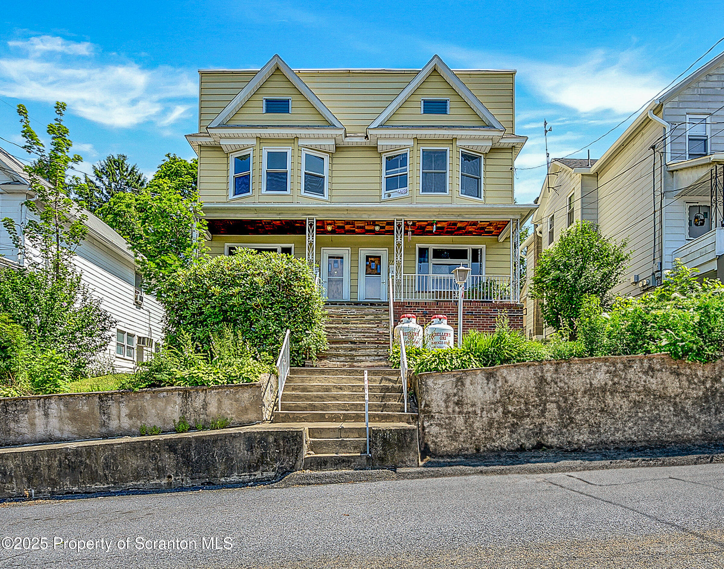 front view of a house with a yard