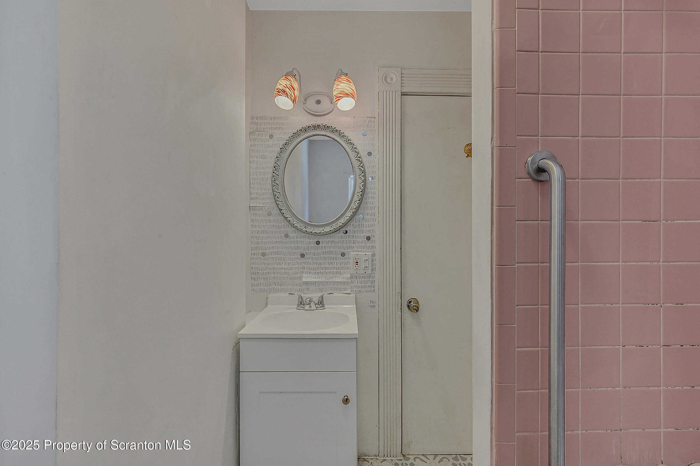 176 Johnson Street Pittston, PA 18640 - Photo 16 of 18 a bathroom with a sink and a mirror