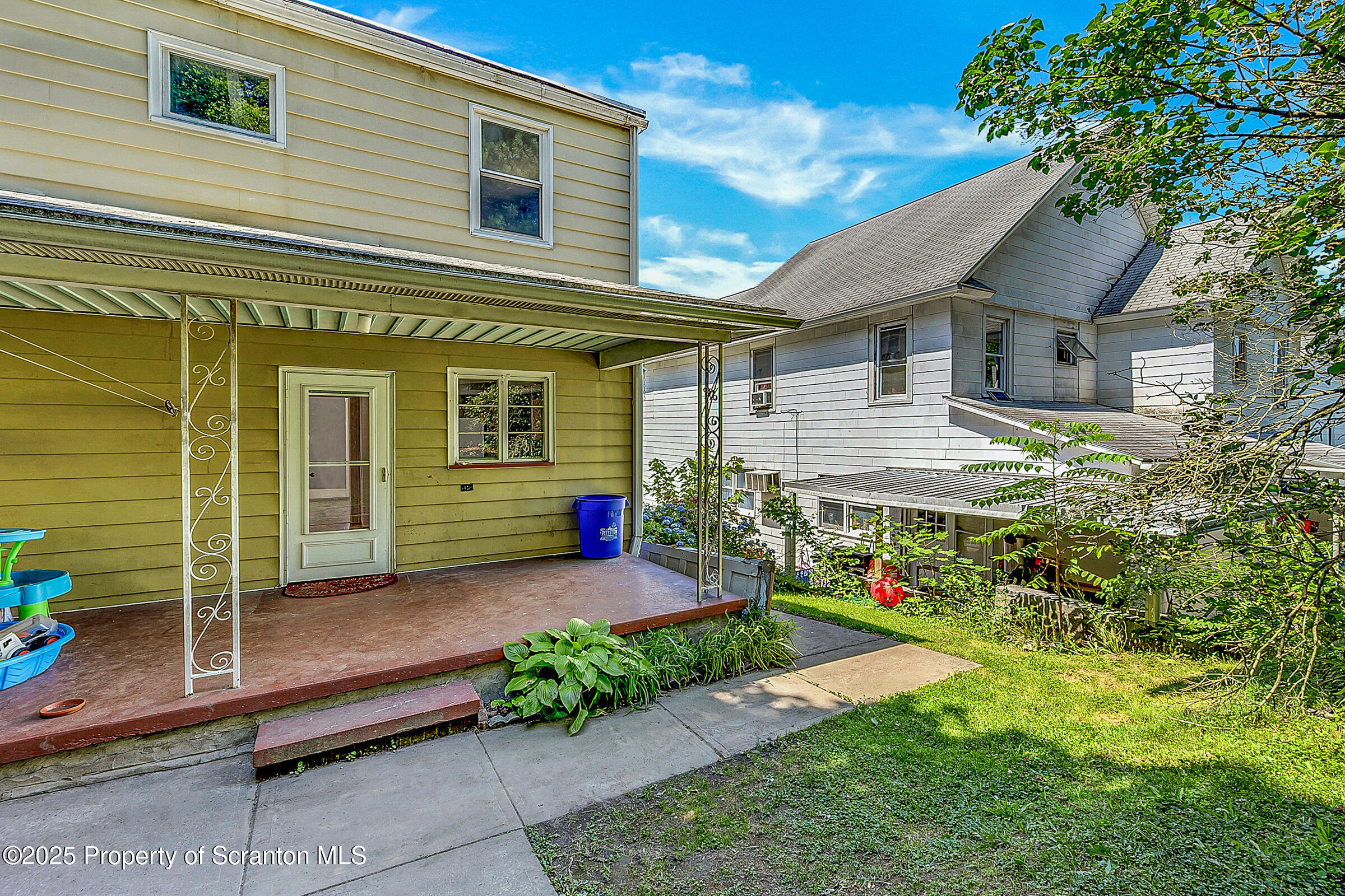 176 Johnson Street Pittston, PA 18640 - Photo 18 of 18 a front view of a house with garden