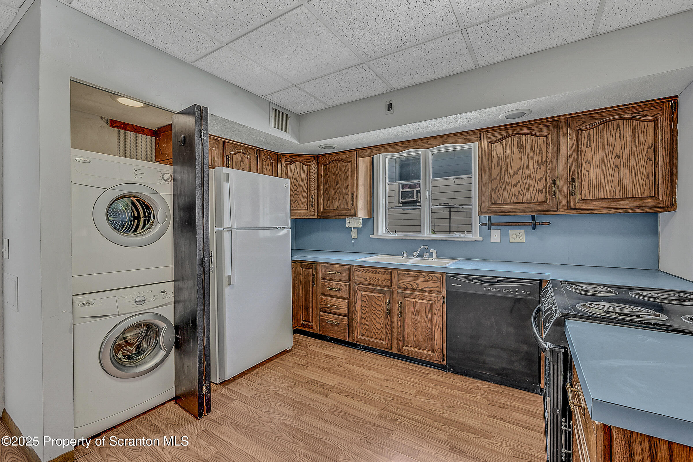 176 Johnson Street Pittston, PA 18640 - Photo 2 of 18 a kitchen with a refrigerator a washer and dryer