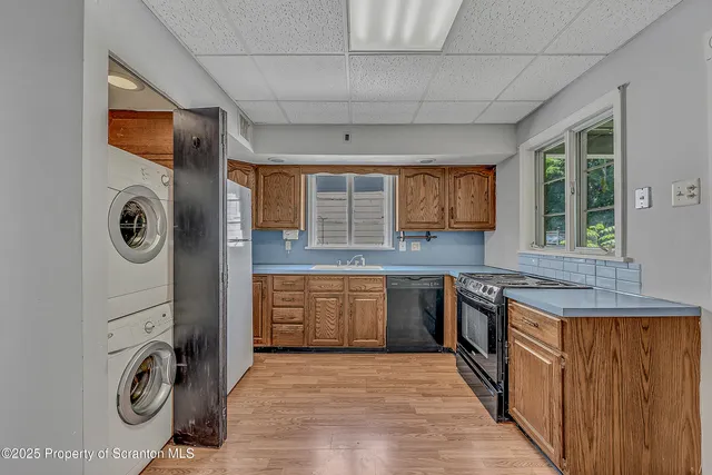 a kitchen with granite countertop a stove and a sink