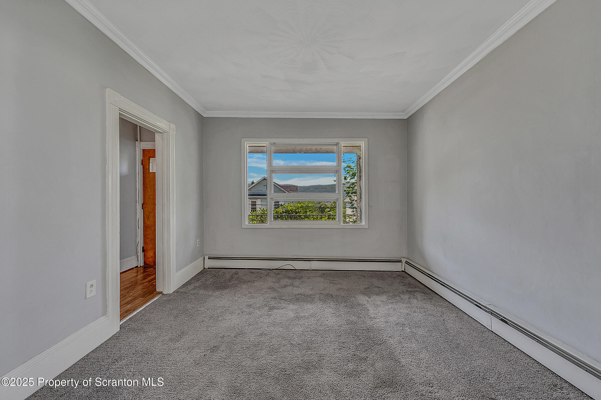 176 Johnson Street Pittston, PA 18640 - Photo 5 of 18 an empty room with windows