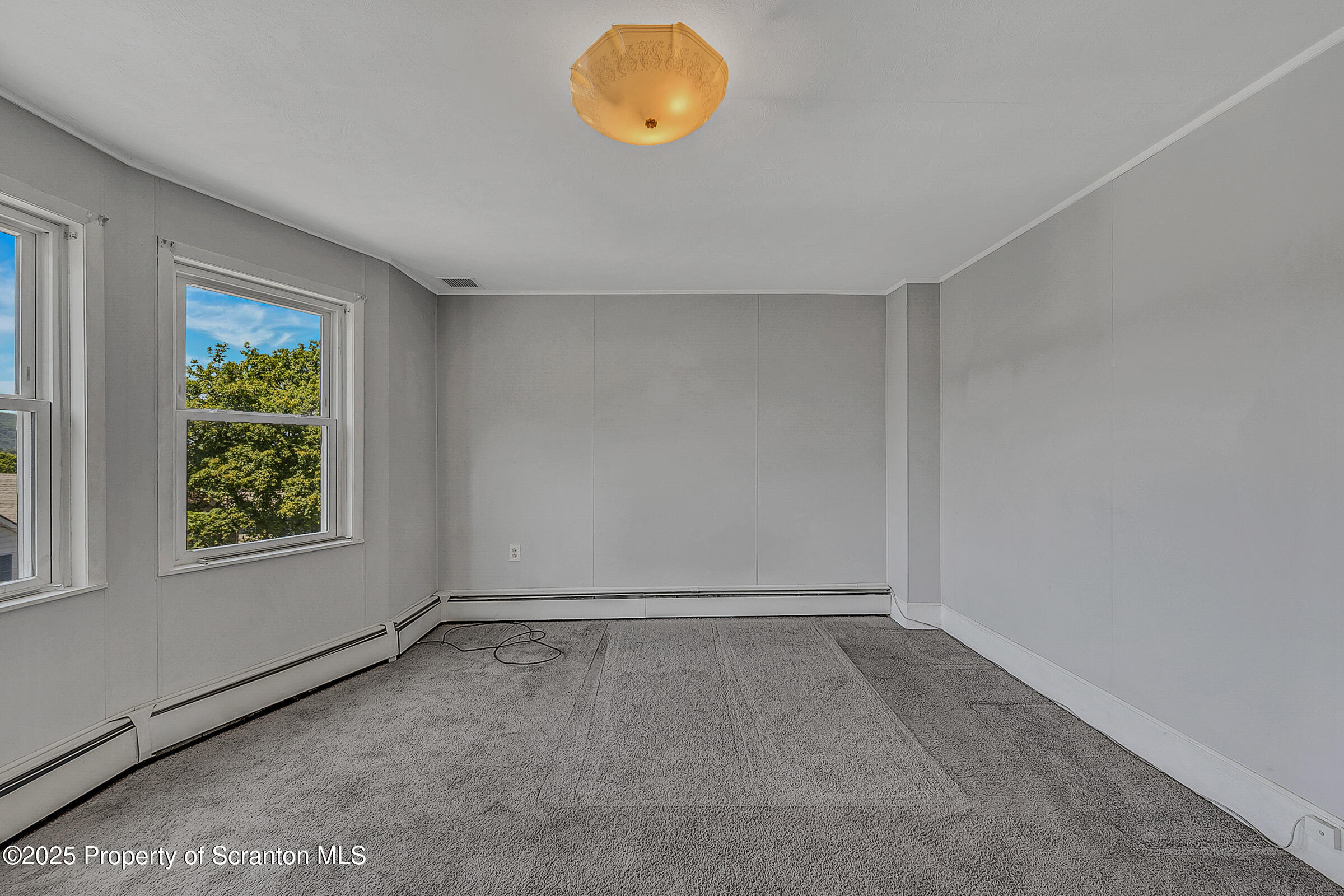 176 Johnson Street Pittston, PA 18640 - Photo 9 of 18 an empty room with windows