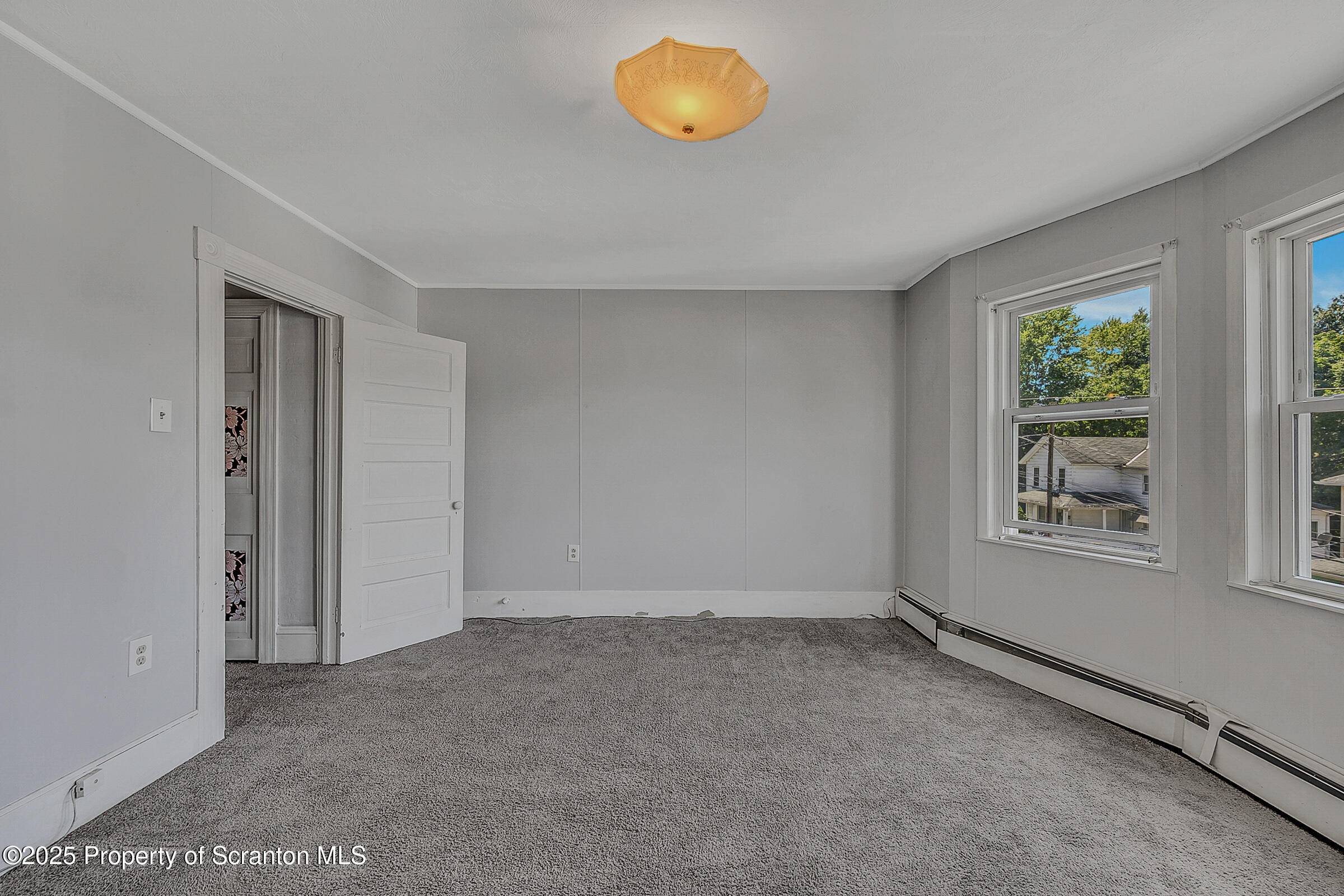 176 Johnson Street Pittston, PA 18640 - Photo 10 of 18 an empty room with windows and tub