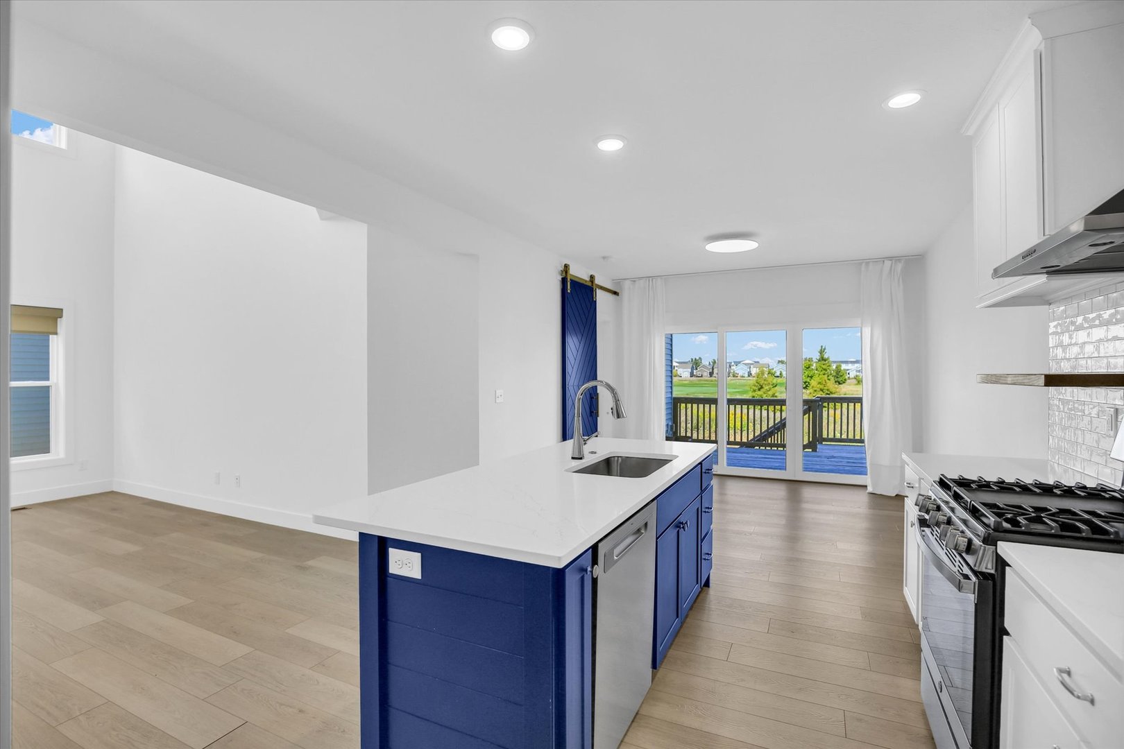 4508 Legends Drive Champaign, IL 61822 - Photo 13 of 45 a kitchen with stainless steel appliances granite countertop a stove a sink and a refrigerator