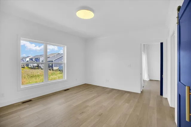 a view of an empty room and a window