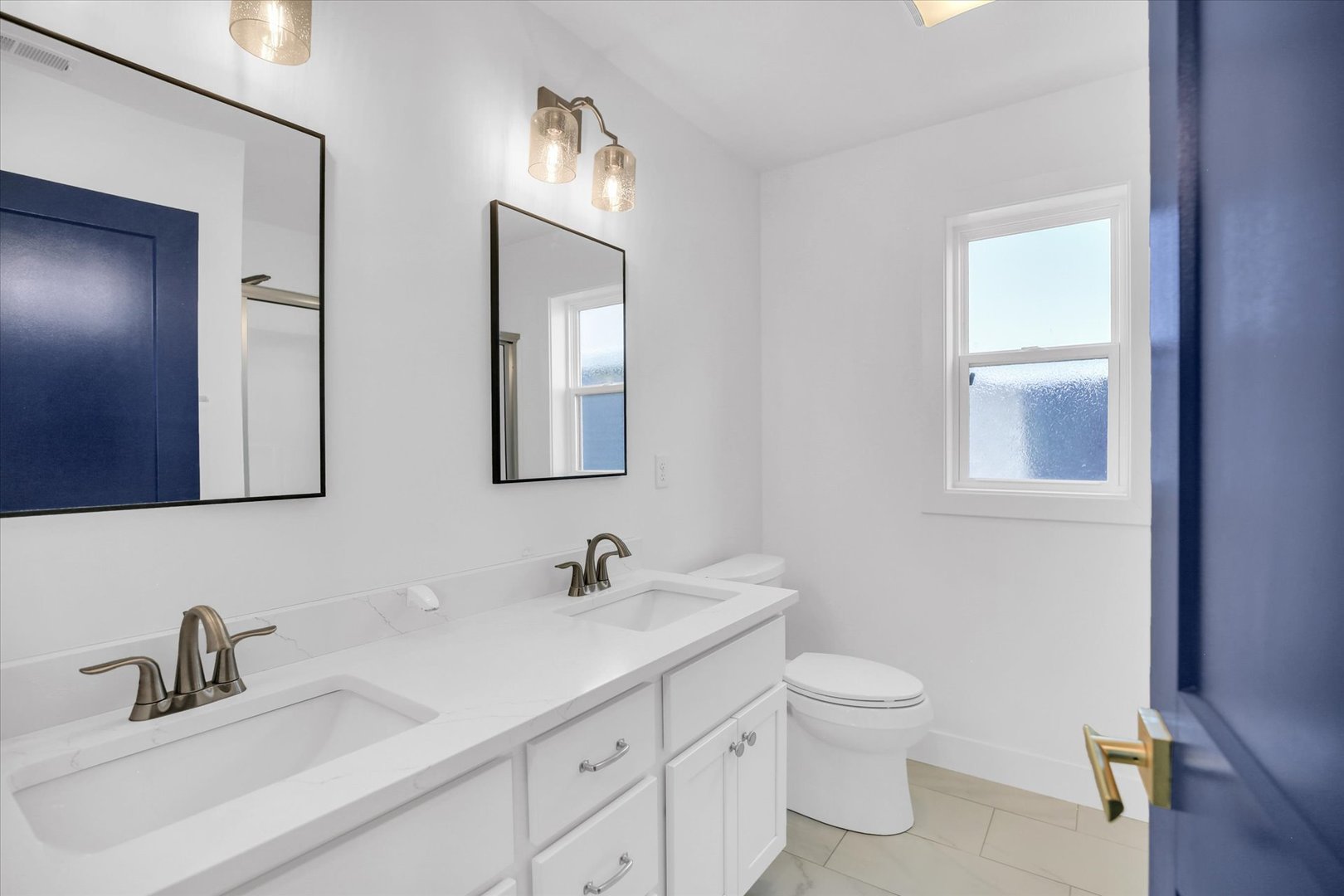 4508 Legends Drive Champaign, IL 61822 - Photo 25 of 45 a bathroom with a toilet a sink a mirror and vanity