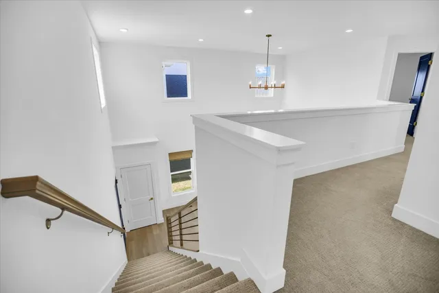 a view of kitchen and hall with wooden floor