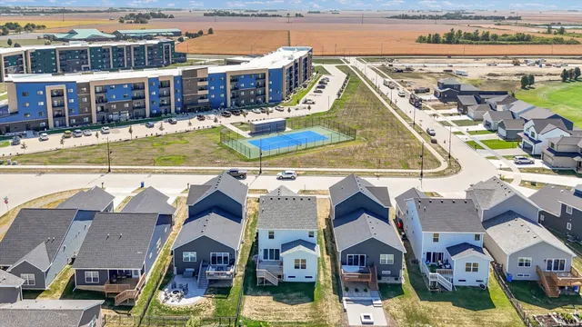 a view of a swimming pool with a yard and seating space