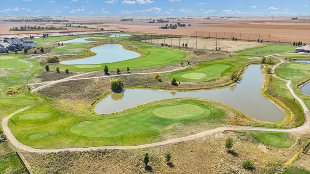 a front view of a house with garden space and street view