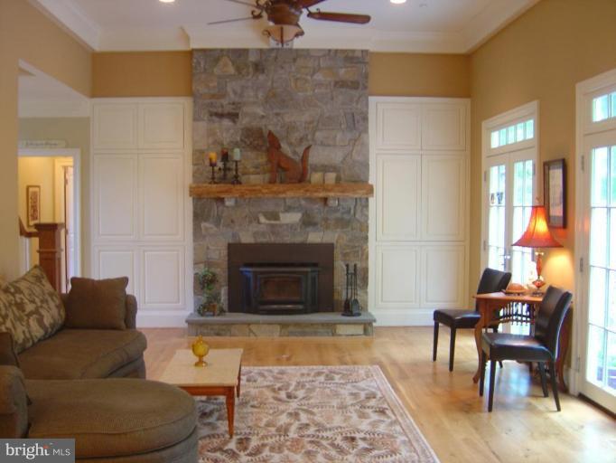16820 Whites Store Road Boyds, MD 20841 - Photo 9 of 30 a living room with furniture and a fireplace