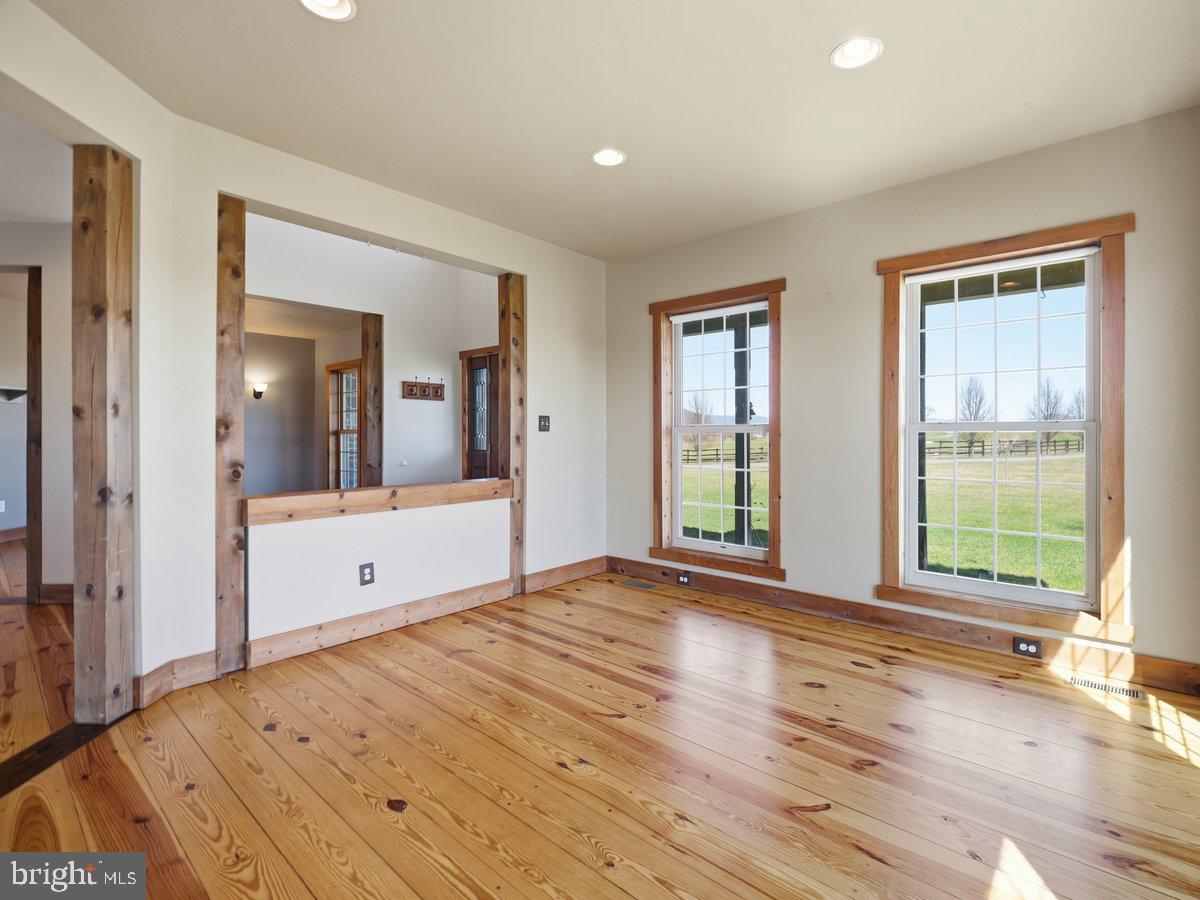 9763 Blue Spring Road Mercersburg, PA 17236 - Photo 11 of 85 a view of an empty room with wooden floor and a window