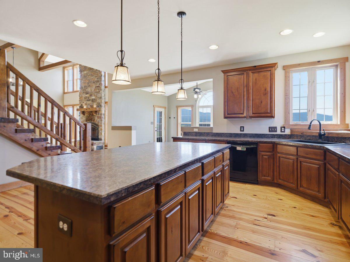 9763 Blue Spring Road Mercersburg, PA 17236 - Photo 25 of 85 a kitchen with stainless steel appliances granite countertop a sink a oven and a center island