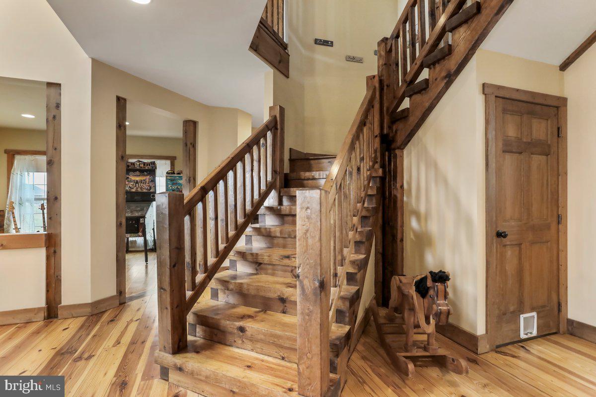 9763 Blue Spring Road Mercersburg, PA 17236 - Photo 30 of 85 a view of staircase with wooden floor and staircase