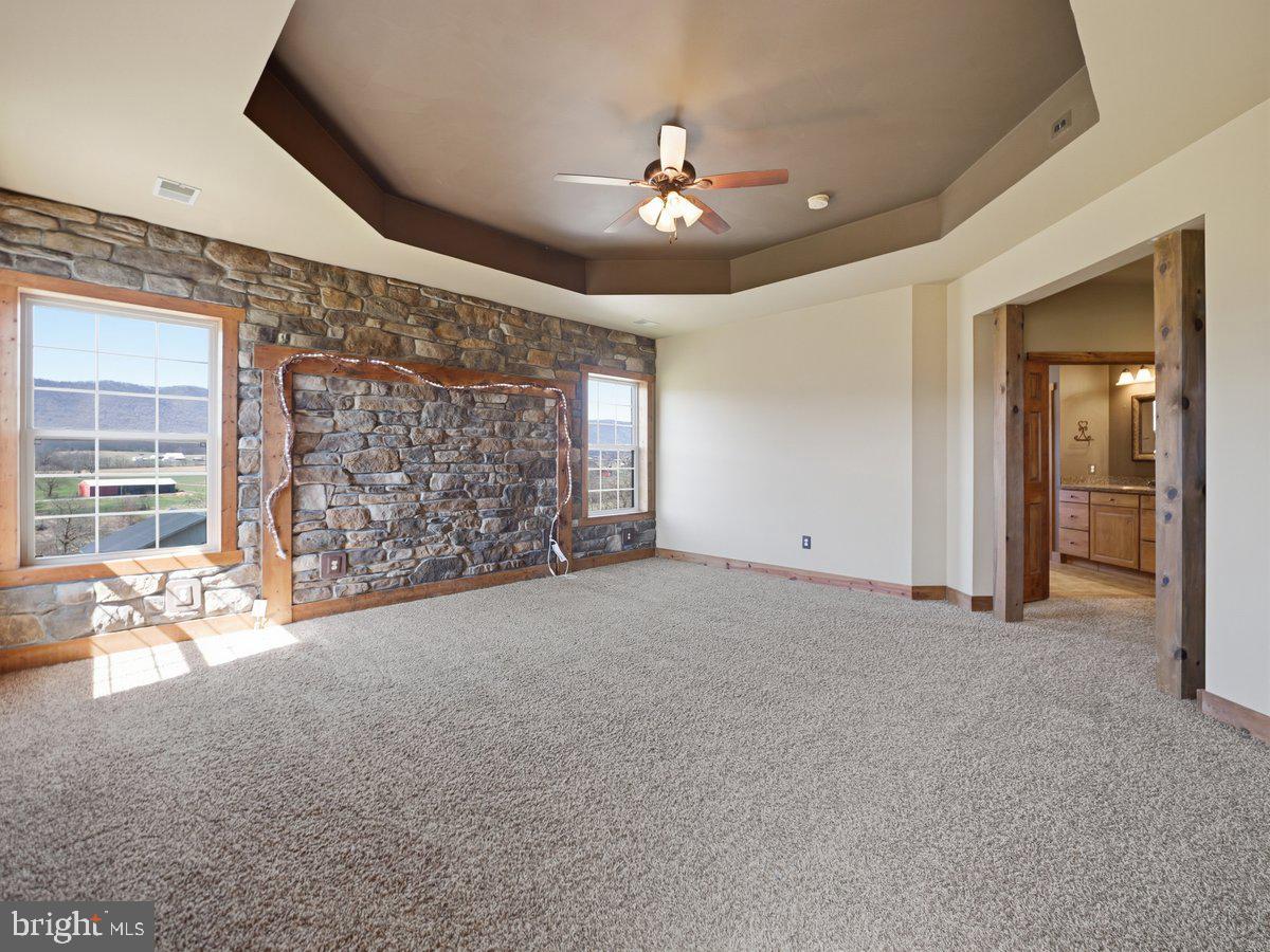 9763 Blue Spring Road Mercersburg, PA 17236 - Photo 34 of 85 a view of an empty room with a fireplace and a window