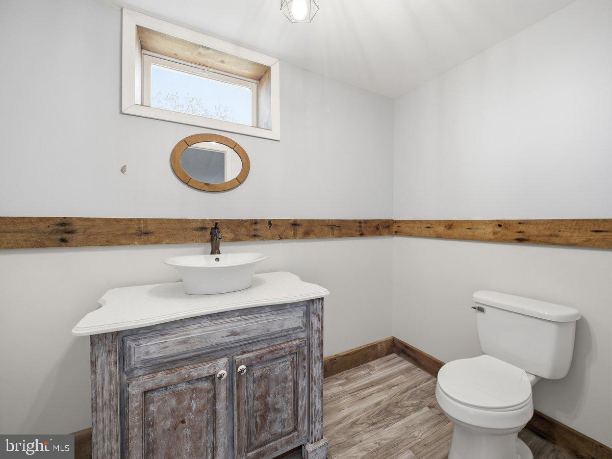 9763 Blue Spring Road Mercersburg, PA 17236 - Photo 57 of 85 a bathroom with a sink and a toilet