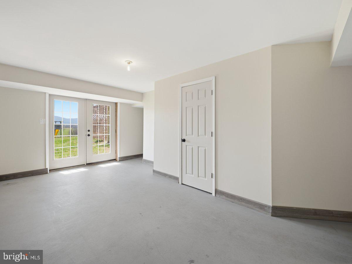 9763 Blue Spring Road Mercersburg, PA 17236 - Photo 58 of 85 a view of a livingroom with an empty space and a window