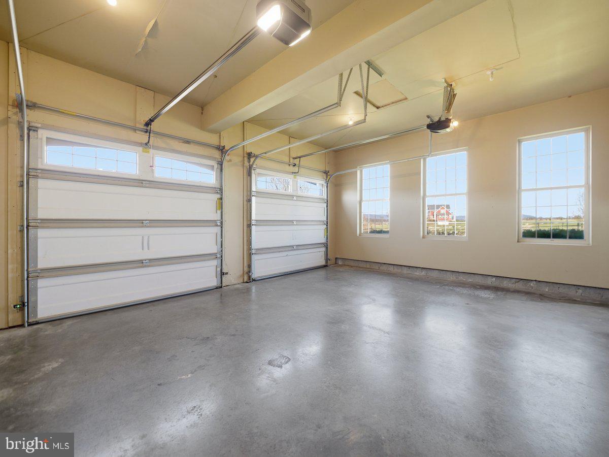 9763 Blue Spring Road Mercersburg, PA 17236 - Photo 60 of 85 en empty room with windows and ceiling fan