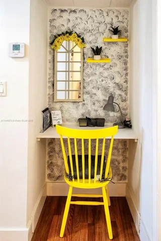 view of pool with a window