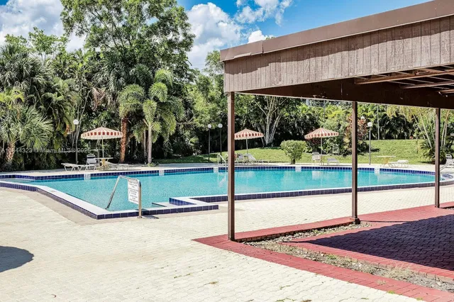 a view of a swimming pool with a patio
