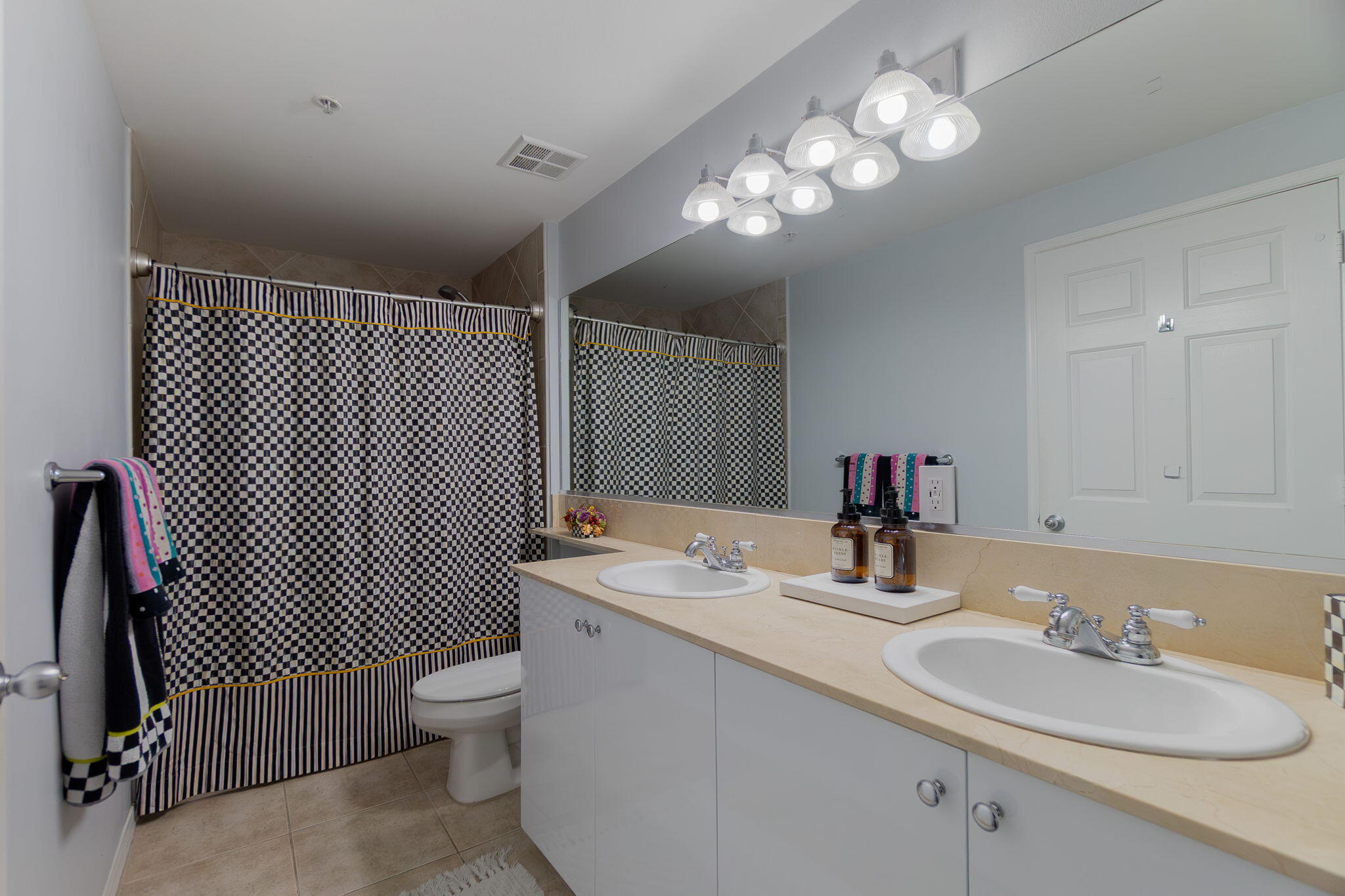 804 East Windward Way, Unit 307 Lantana, FL 33462 - Photo 15 of 44 a bathroom with a sink double vanity and a toilet