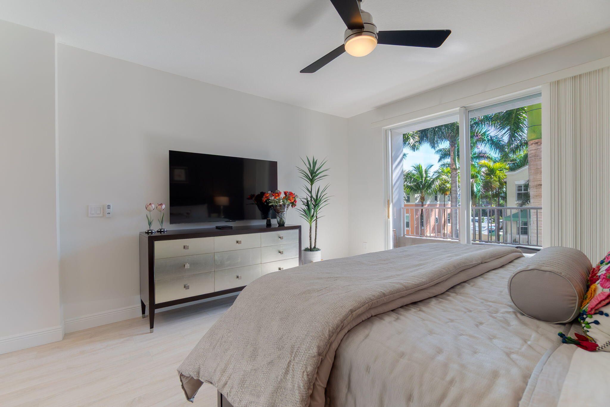 804 East Windward Way, Unit 307 Lantana, FL 33462 - Photo 18 of 44 a bedroom with a bed and a flat screen tv