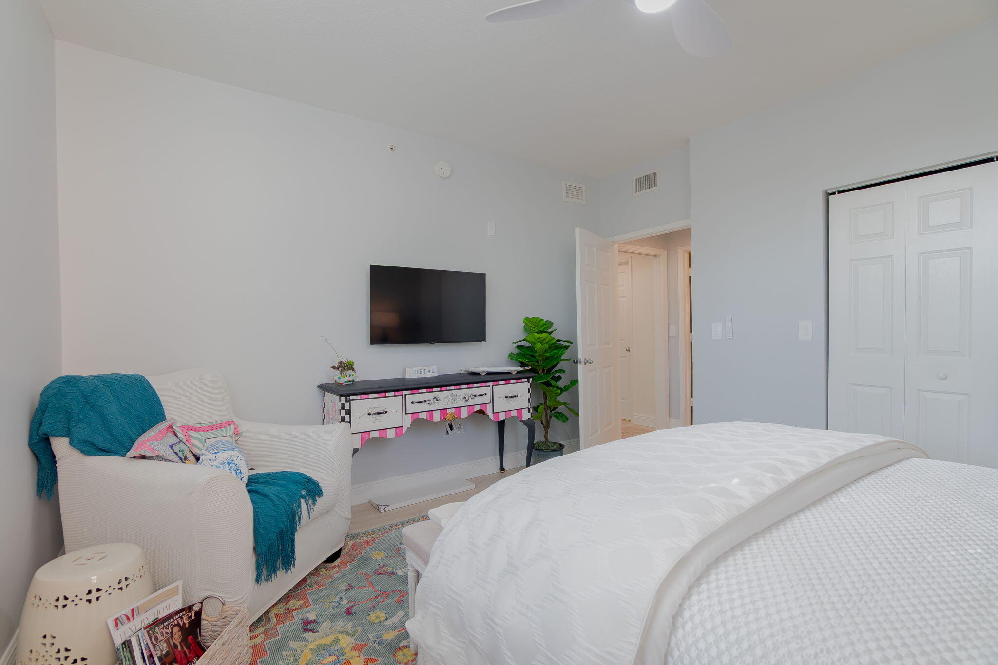 804 East Windward Way, Unit 307 Lantana, FL 33462 - Photo 21 of 44 a bedroom with a bed and a flat screen tv