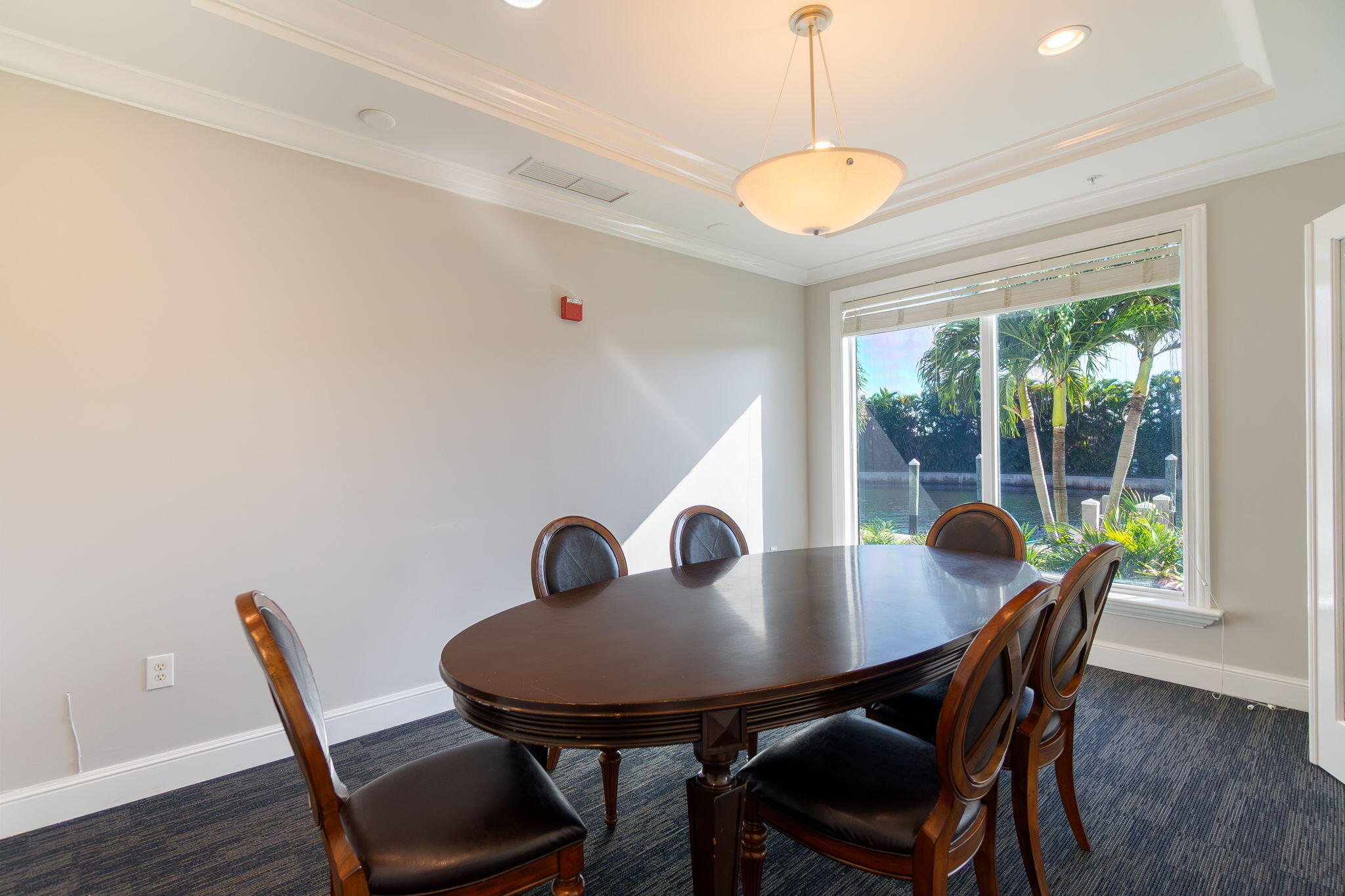 804 East Windward Way, Unit 307 Lantana, FL 33462 - Photo 36 of 44 a view of a dining room with furniture window and wooden floor