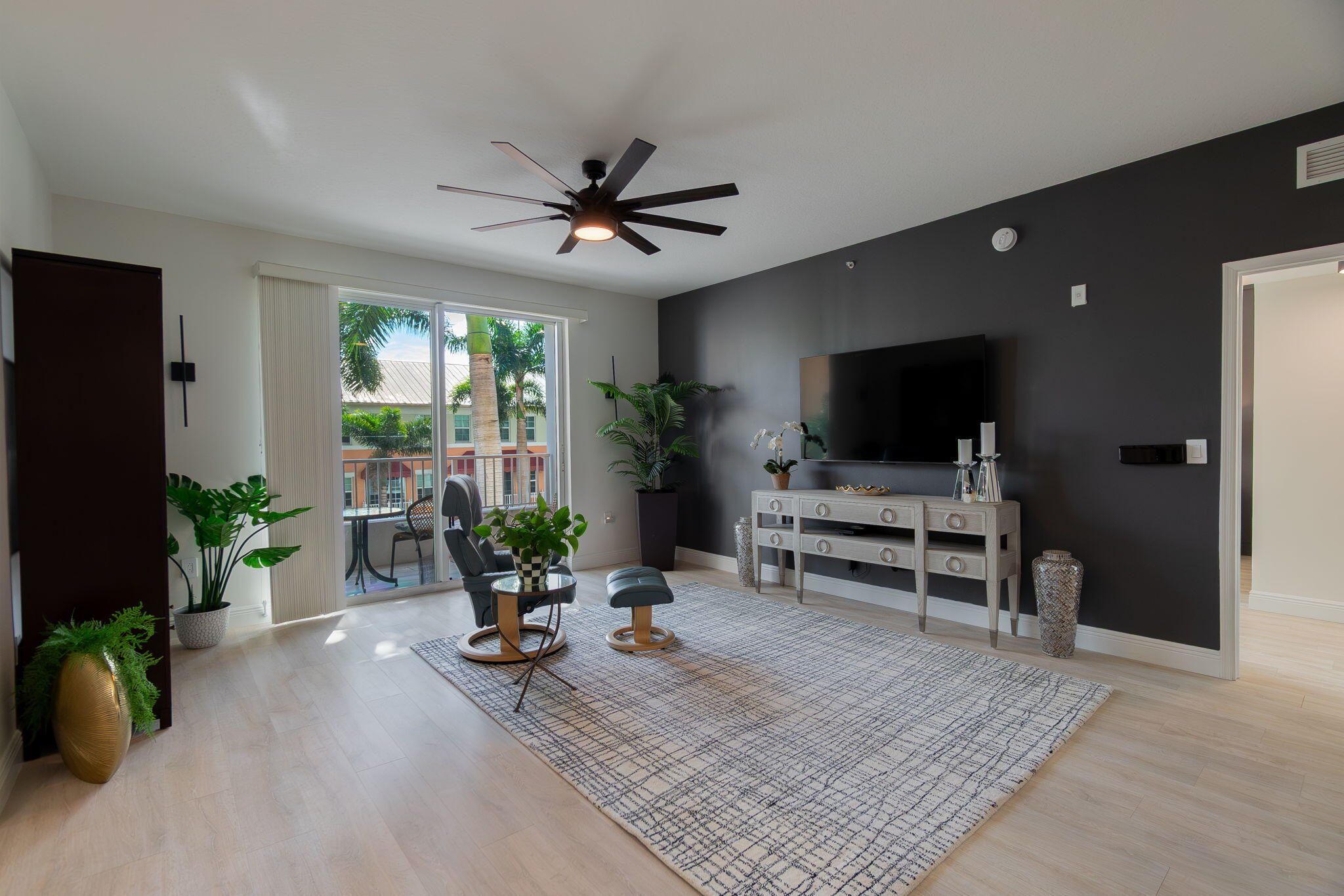 804 East Windward Way, Unit 307 Lantana, FL 33462 - Photo 4 of 44 a living room with furniture and a flat screen tv