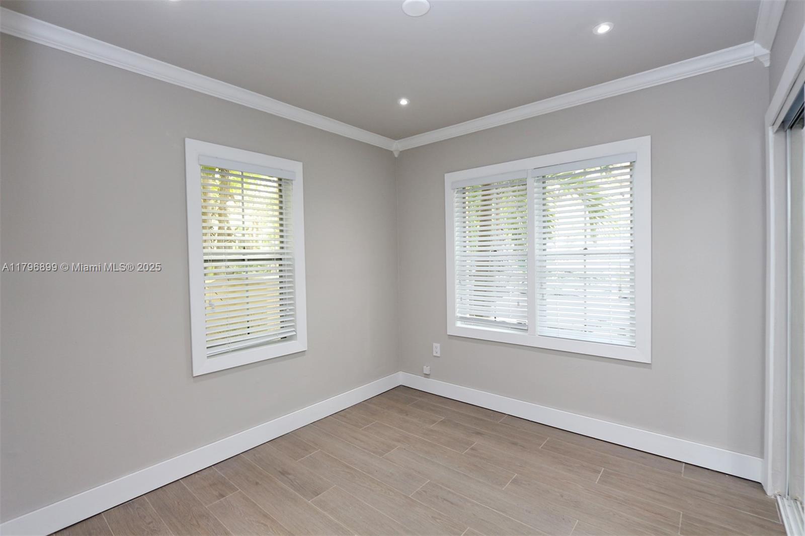 3375 Franklin Avenue, Unit D Miami, FL 33133 - Photo 14 of 33 an empty room with a window