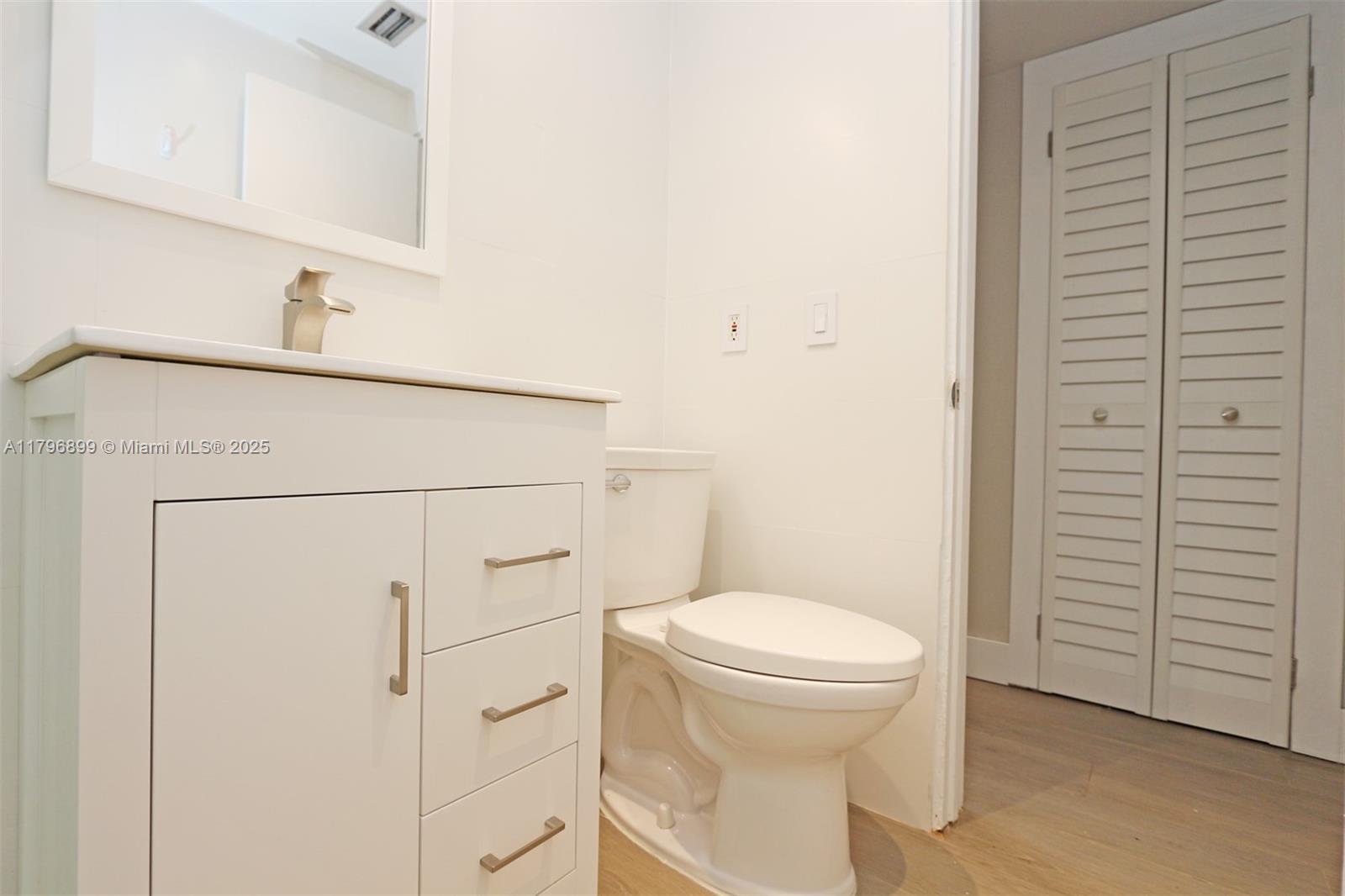 3375 Franklin Avenue, Unit D Miami, FL 33133 - Photo 20 of 33 a bathroom with a toilet and a sink