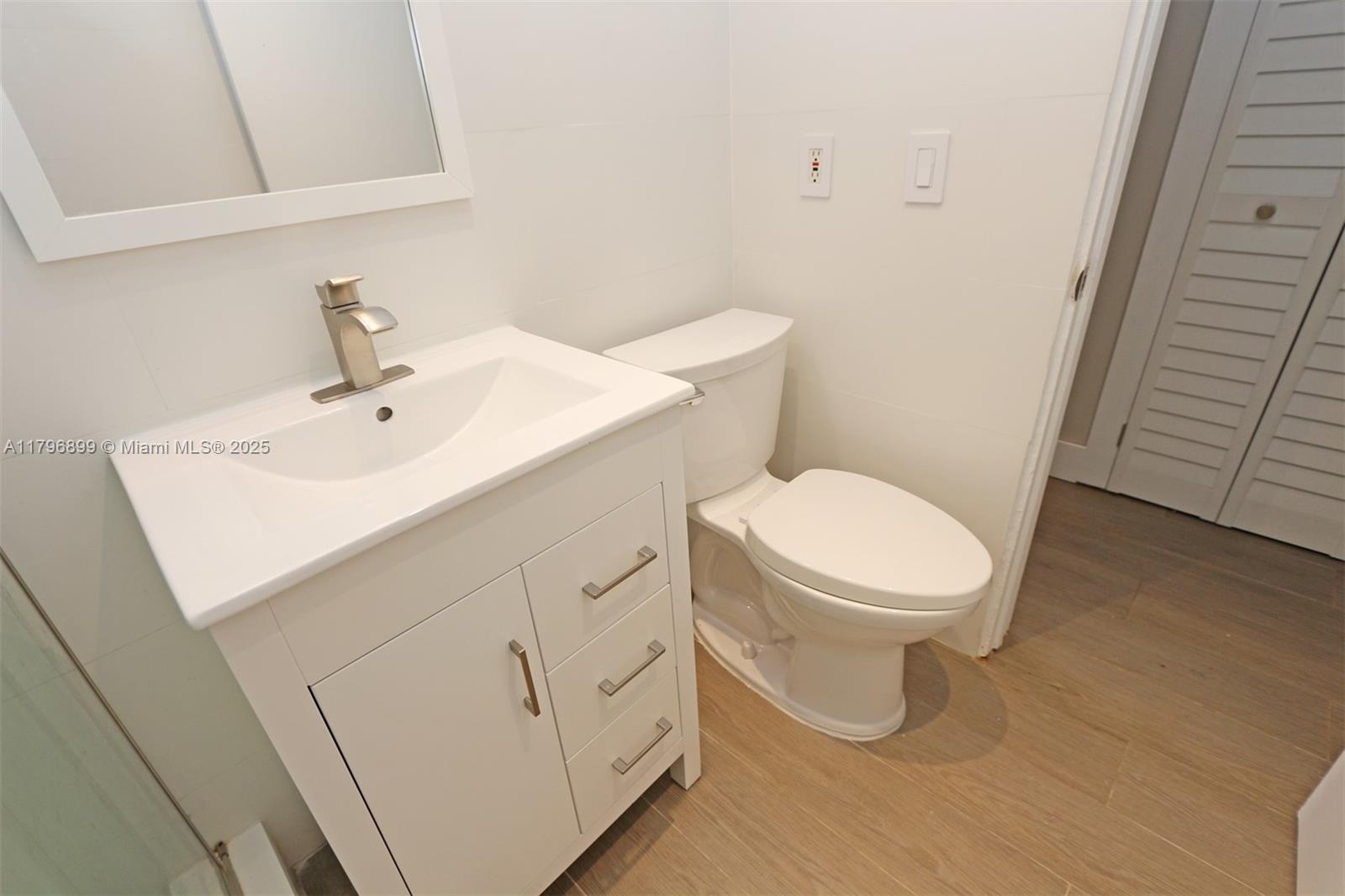 3375 Franklin Avenue, Unit D Miami, FL 33133 - Photo 21 of 33 a white toilet sitting next to a white sink