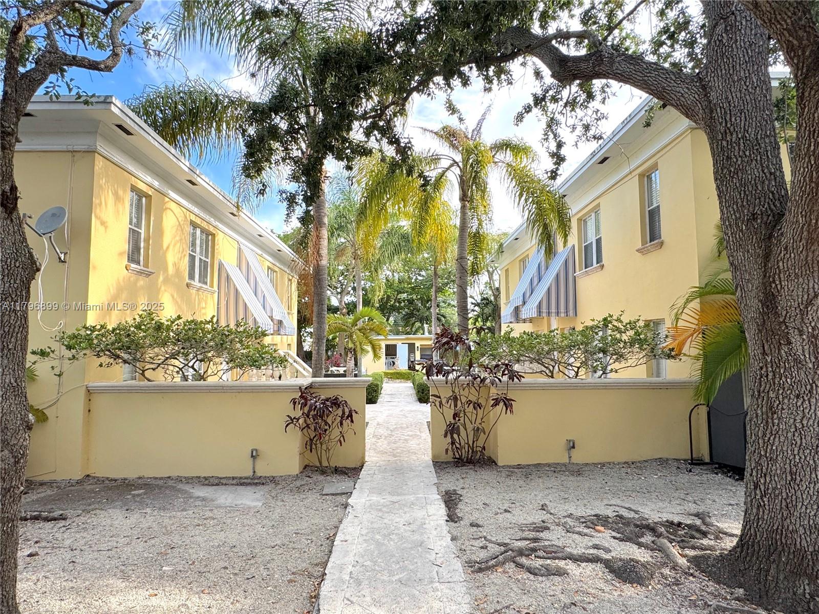 3375 Franklin Avenue, Unit D Miami, FL 33133 - Photo 32 of 33 a view of a house with a yard
