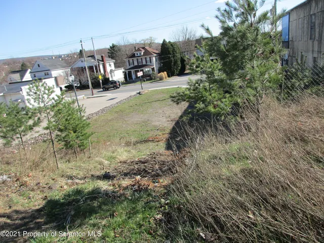 a view of a town with barn
