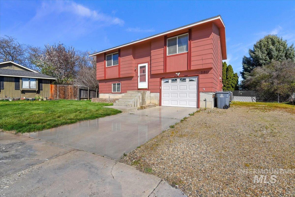 2811 Apollo Place Caldwell, ID 83605 - Photo 3 of 31 Raised ranch featuring concrete driveway and a garage