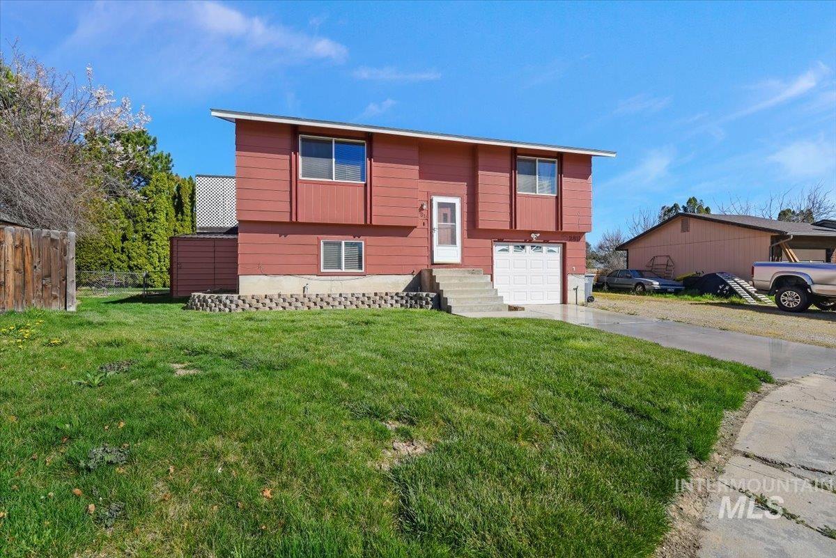 2811 Apollo Place Caldwell, ID 83605 - Photo 4 of 31 Bi-level home featuring a garage and driveway