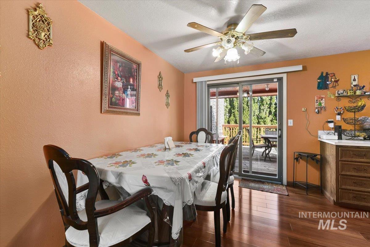 2811 Apollo Place Caldwell, ID 83605 - Photo 8 of 31 Dining room with dark wood-type flooring, a textured ceiling, and a ceiling fan