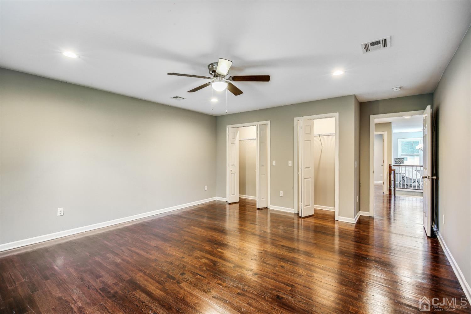 9 Markham Road Edison, NJ 08817 - Photo 18 of 28 a view of an empty room with window and wooden floor
