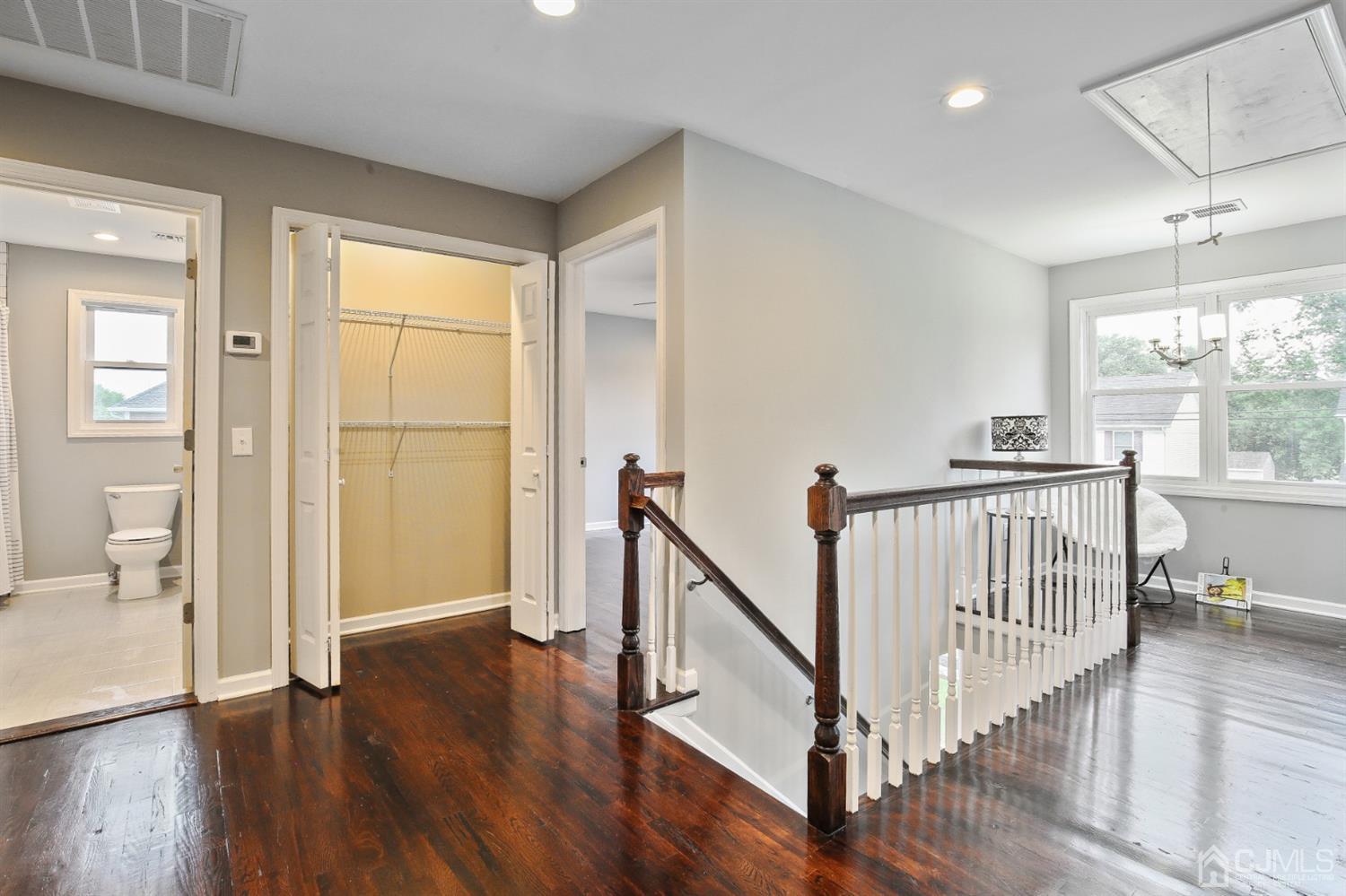 9 Markham Road Edison, NJ 08817 - Photo 22 of 28 a view of a hallway with wooden floor and windows