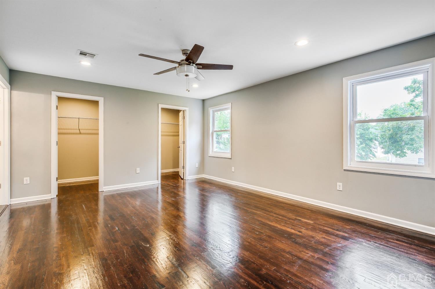 9 Markham Road Edison, NJ 08817 - Photo 23 of 28 a view of an empty room with wooden floor and a window