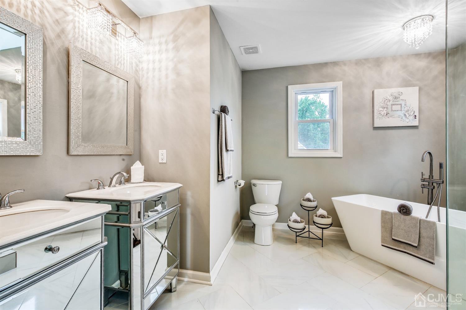 9 Markham Road Edison, NJ 08817 - Photo 24 of 28 a bathroom with a sink a toilet and a mirror