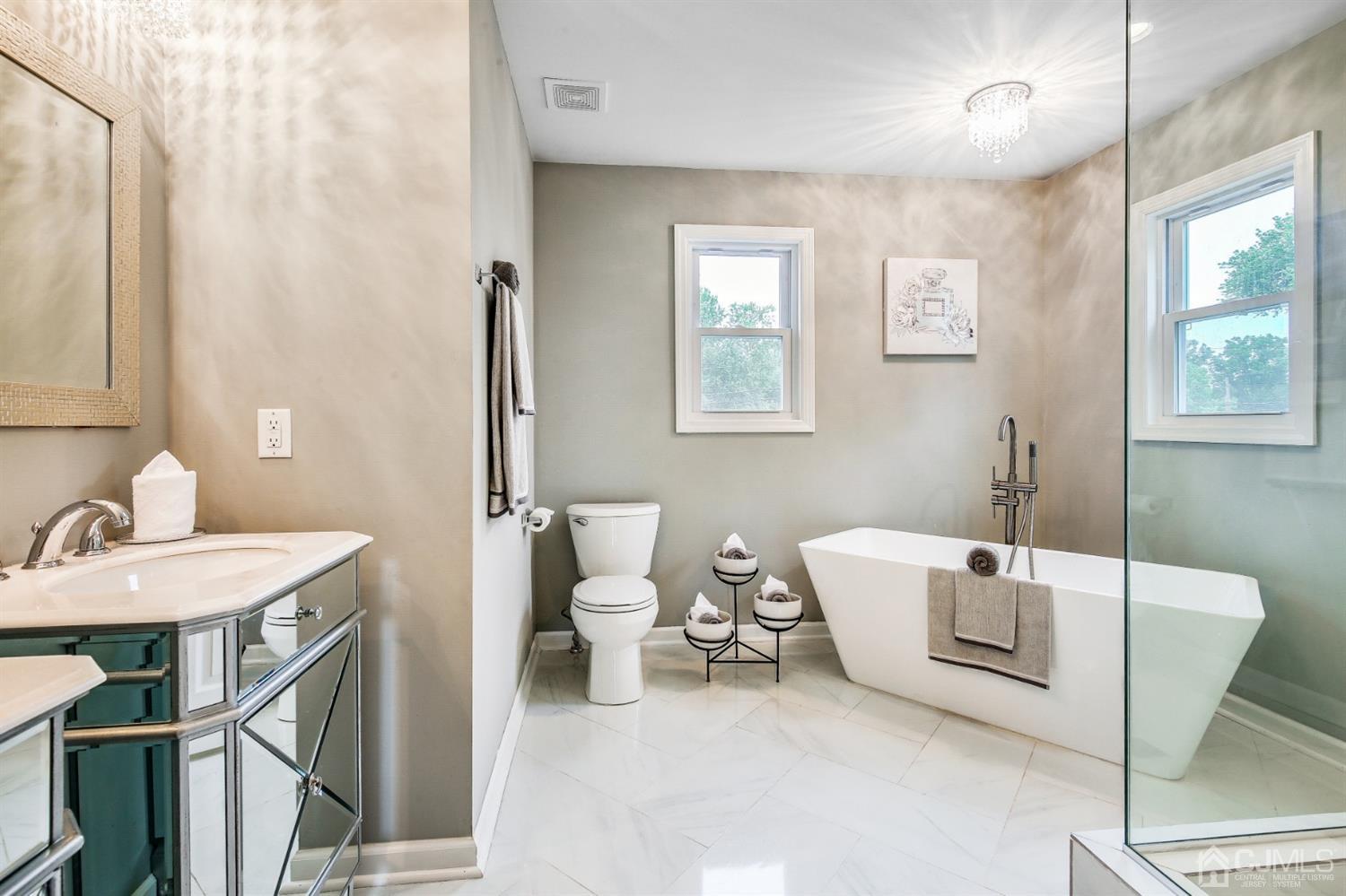 9 Markham Road Edison, NJ 08817 - Photo 25 of 28 a bathroom with a sink and a mirror